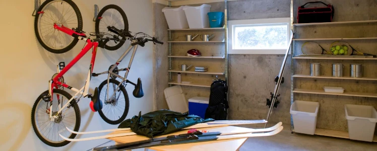 Overhead storage setups in a garage, like a bike rack