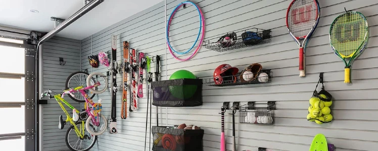 Sports gear being hung up against the wall