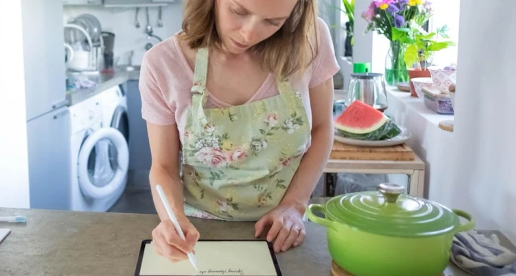 A person going through a kitchen spring cleaning house checklist