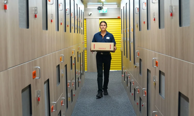 A happy collector accessing their wine storage unit.